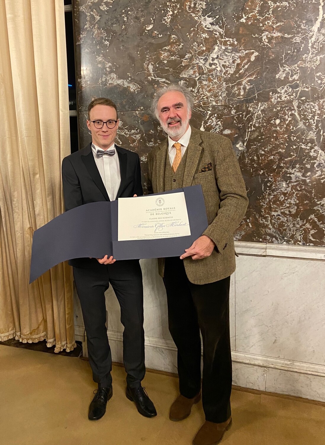 Award in Brussels: Dr Gilles Mordant on the left, Professor Didier Viviers (left), Secretary of the Belgian Royal Academy of Sciences (right)